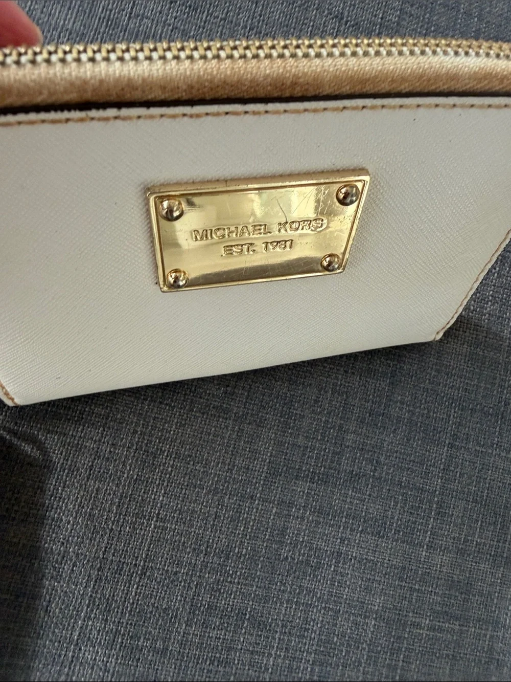 Michael Kors Cream Zip Wristlet with Gold Plaque
